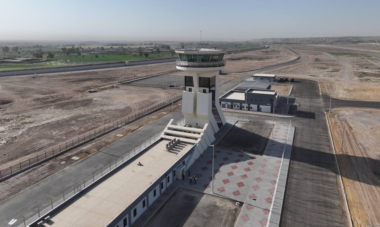 The reconstructed terminal of Mosul International Airport, with the runway and air-traffic control tower visible.