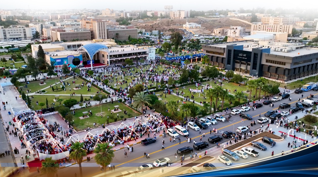 The main campus of the University of Mosul during a major institutional celebration, with the Central Library visible at right.